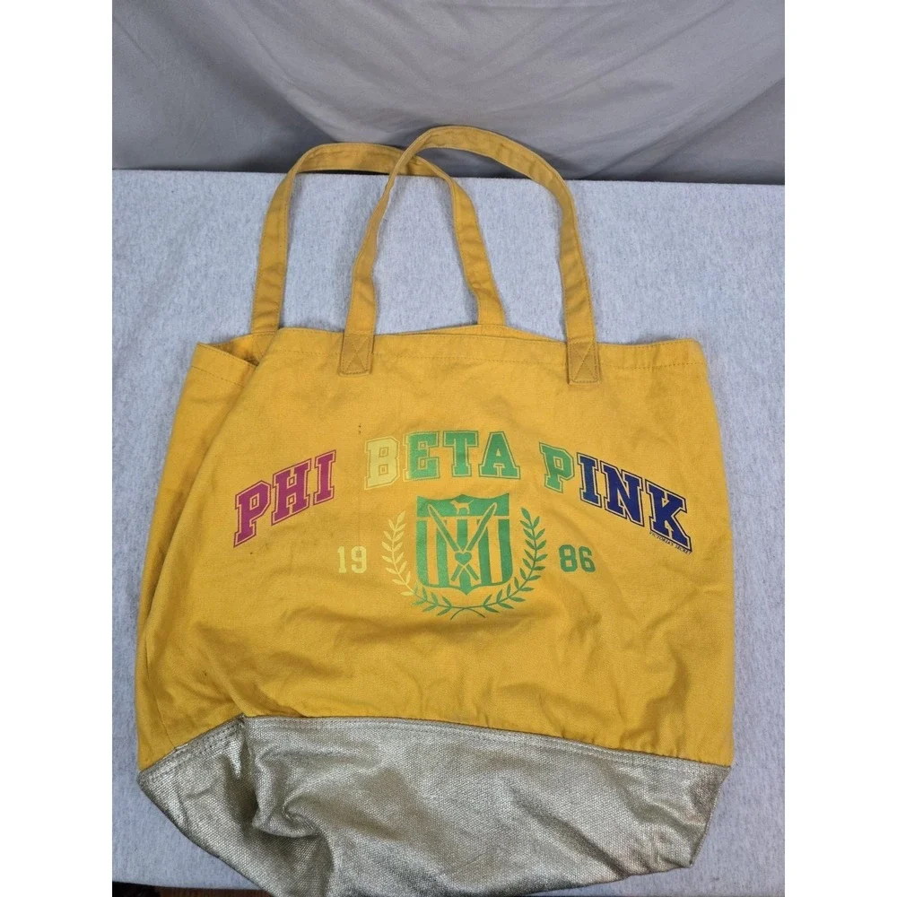 yellow Victoria's Secret PINK canvas tote bag silver bottom